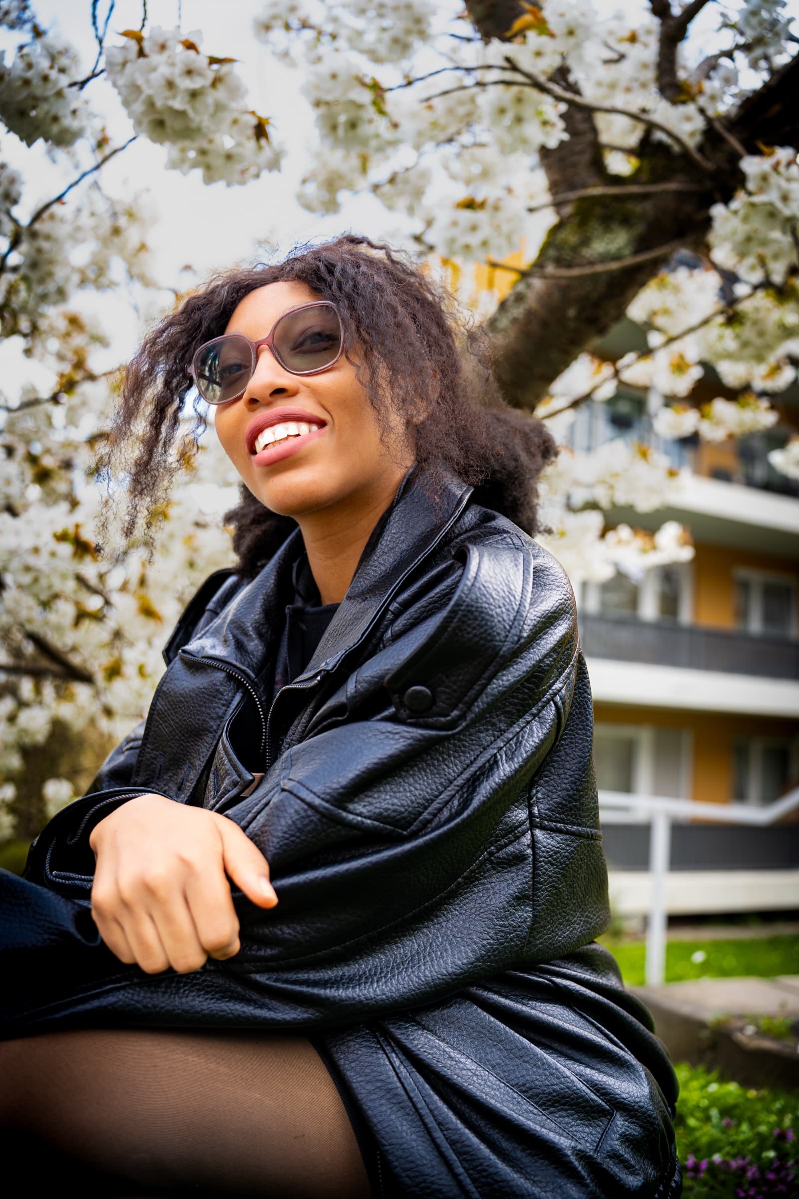 Leather jacket portrait under cherry blossoms