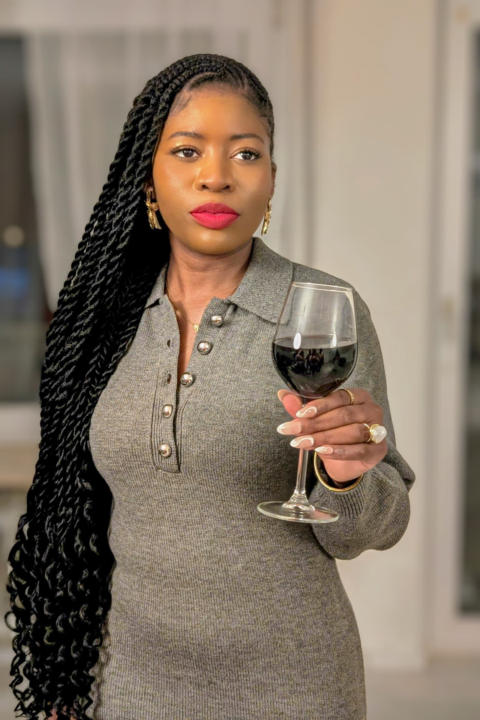 Knit dress, red wine glass, calm window light