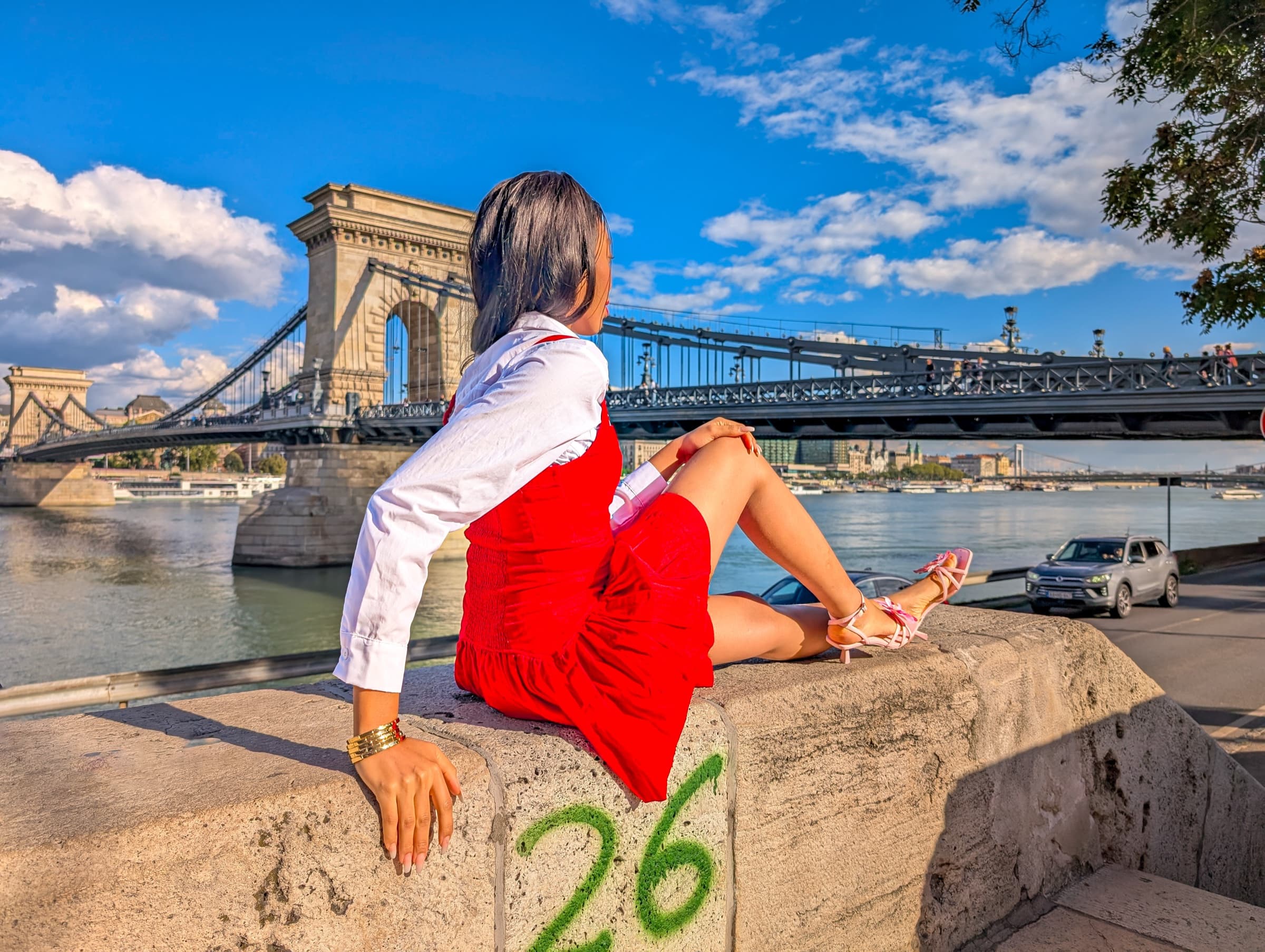 Red dress, looking out across the Danube toward the Chain Bridge